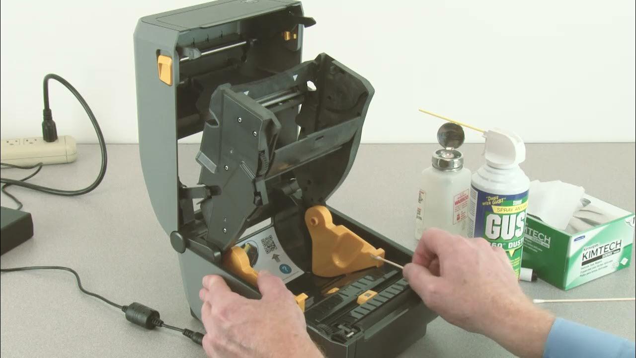 Cách thay đầu in máy in nhãn